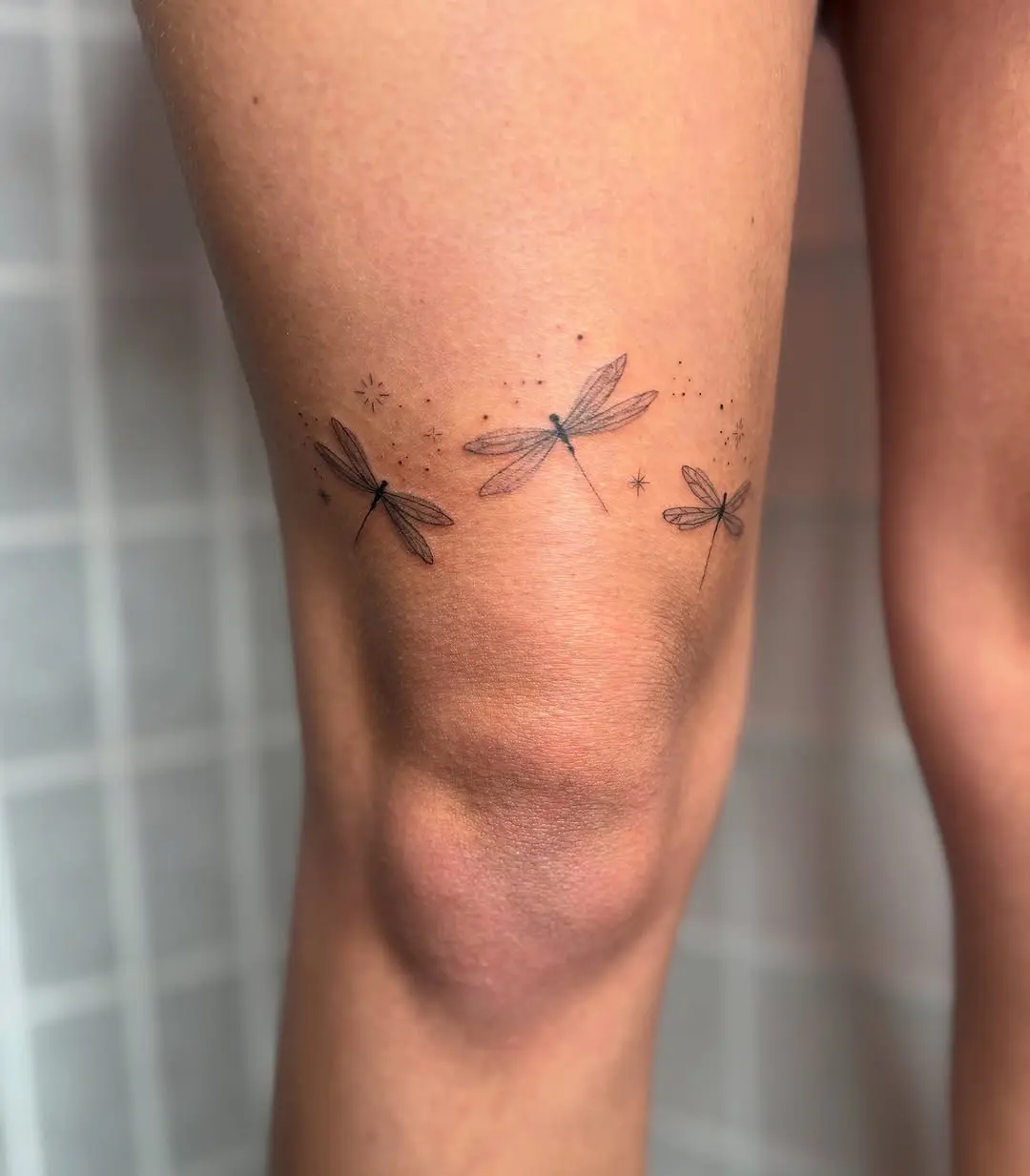 Elegant Firefly Tattoos Adorning the Leg