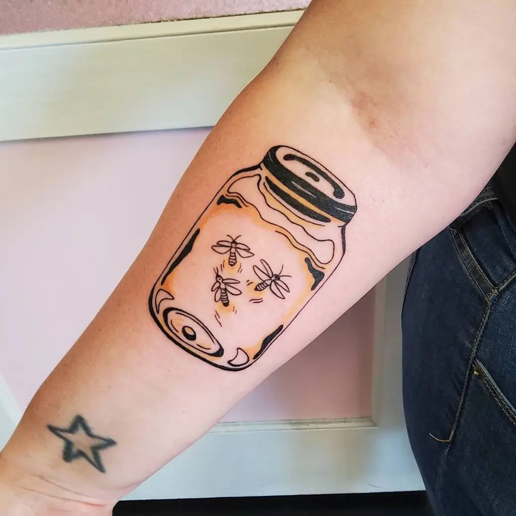 Elegant firefly jar tattoo with glowing essence