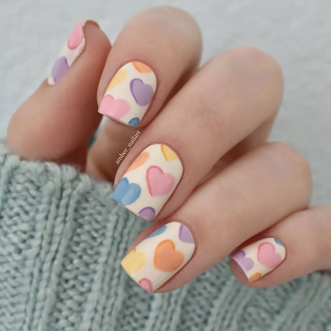 Charming pastel heart nail art design