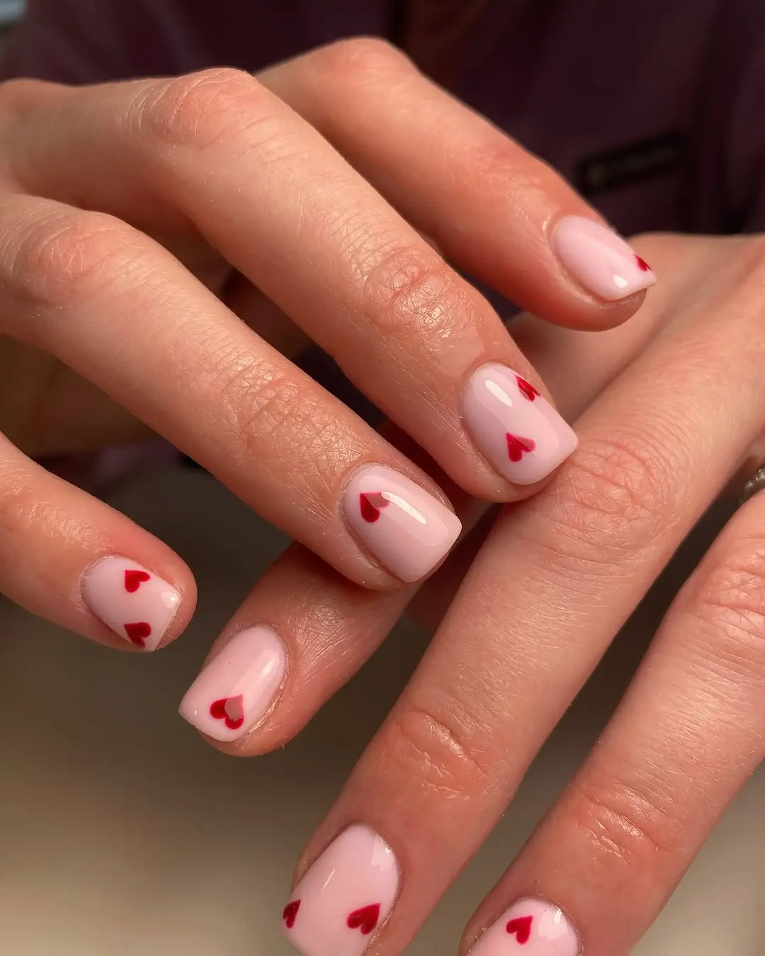 Charming heart-themed nail art design