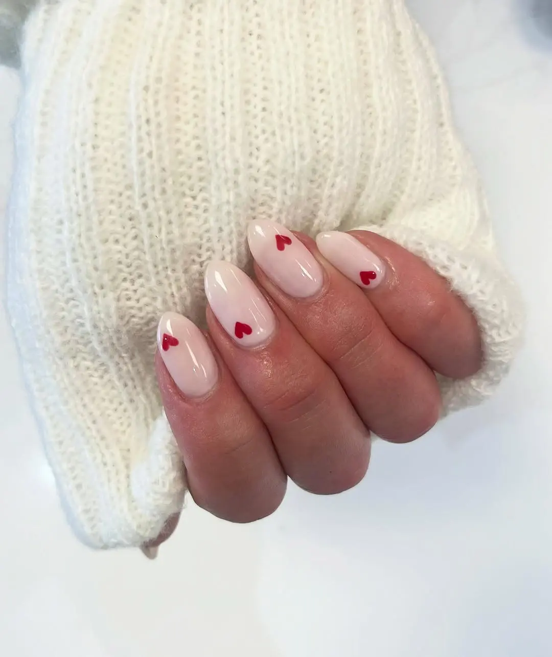Charming heart pattern on soft pink nails