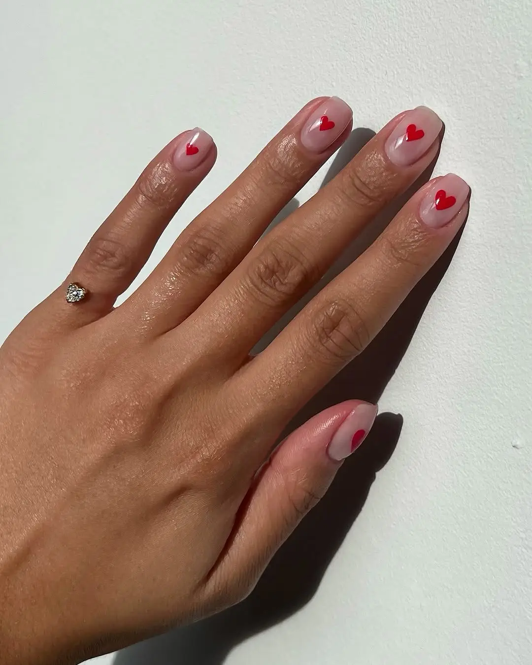 Charming red heart nail art design