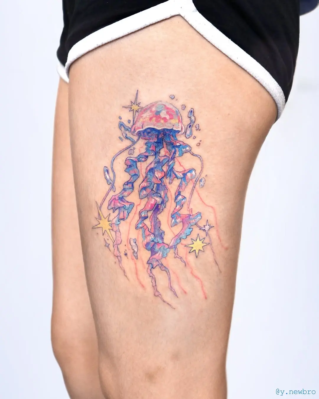 Colorful jellyfish tattoo radiating whimsical vibes