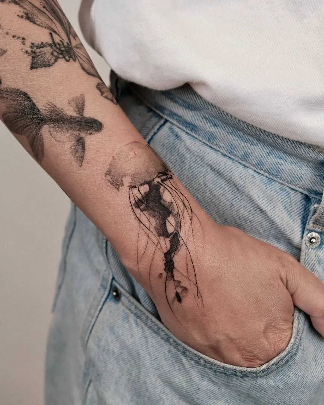 Delicate jellyfish tattoo with artistic flair