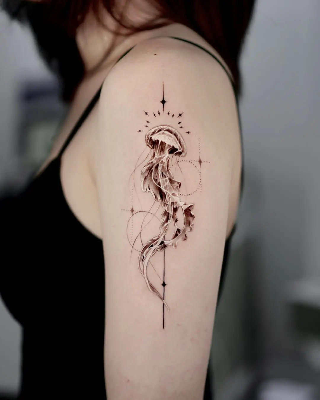 Elegant jellyfish tattoo with geometric accents