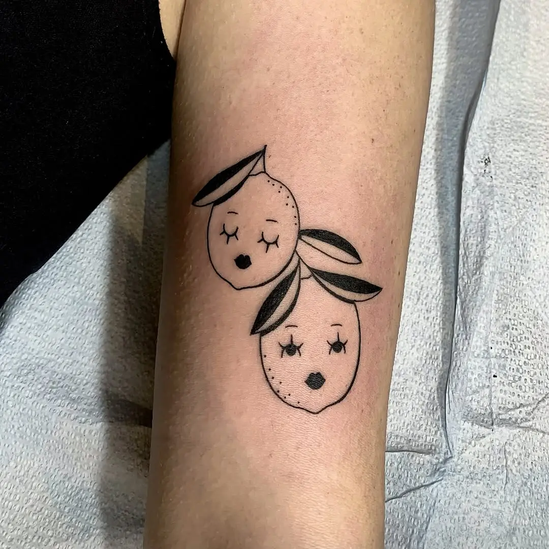 Whimsical Lemon Tattoos with Charming Faces