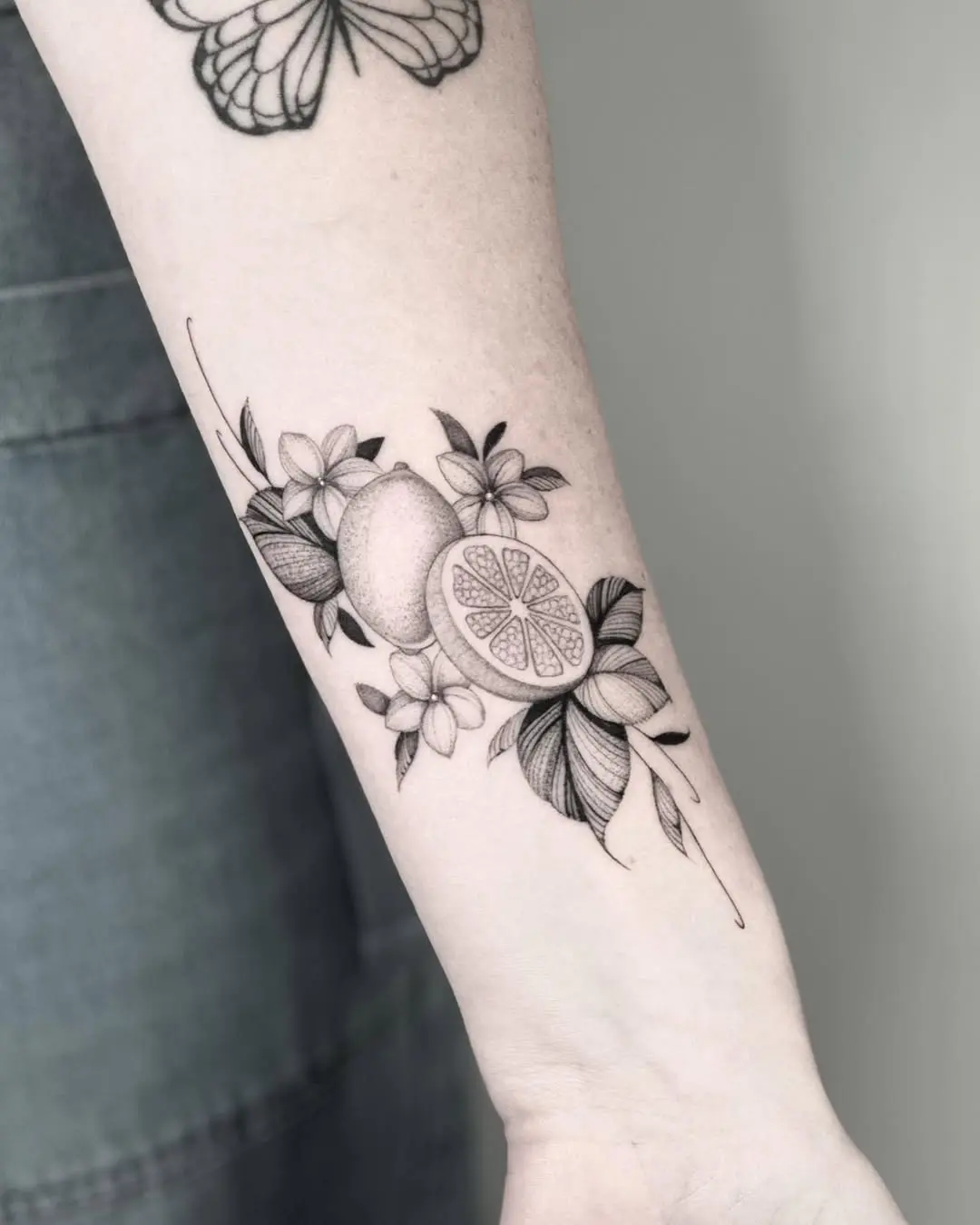 Elegant black and white lemon tattoo design