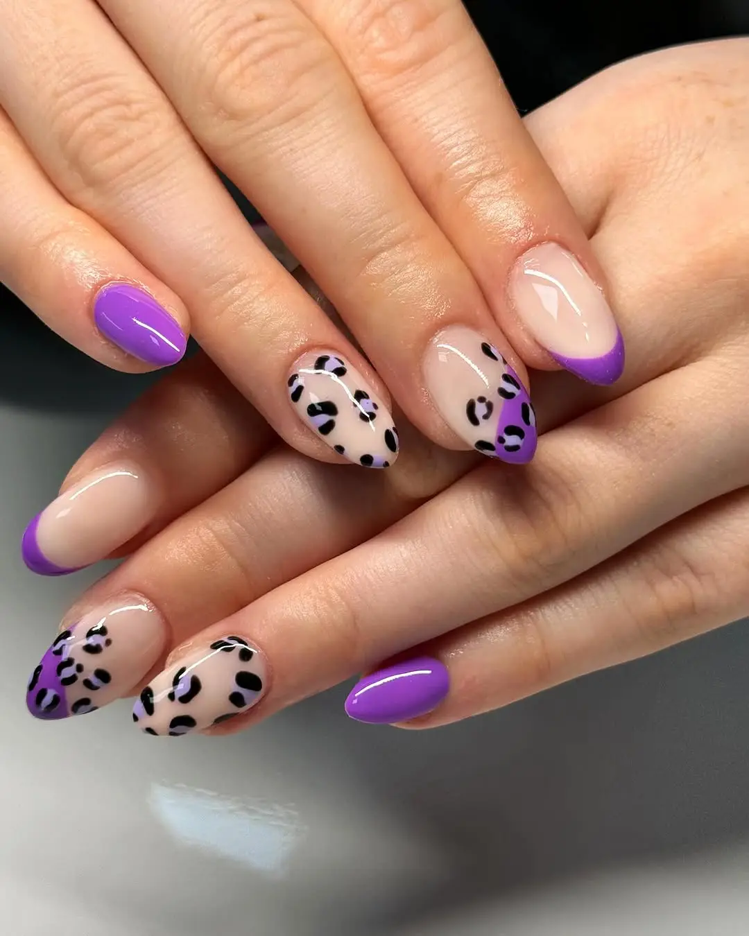 Chic leopard nails with purple accents