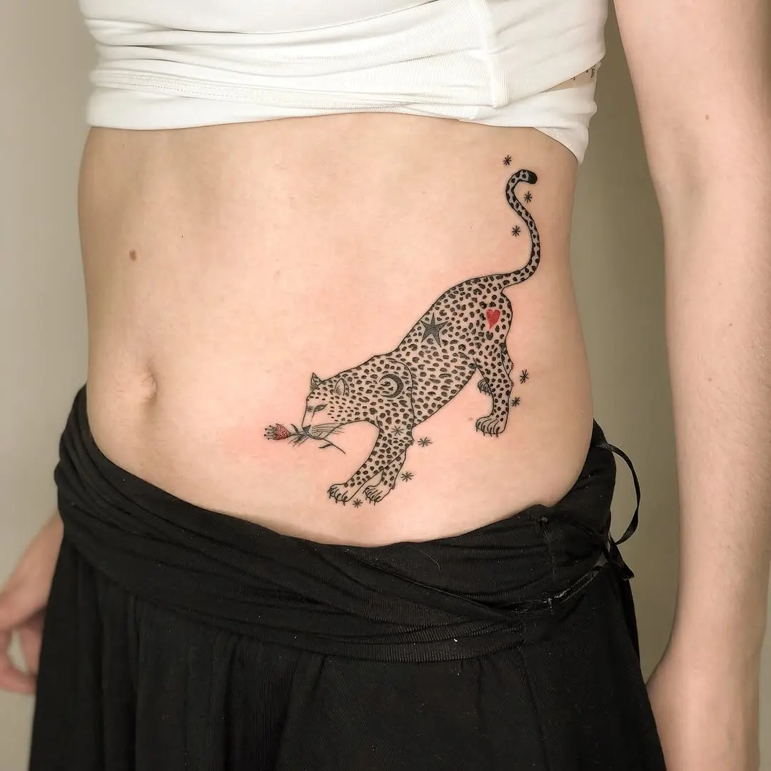 Stylish leopard tattoo with floral accents