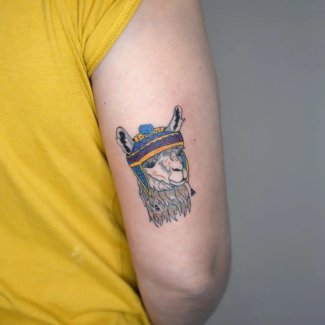 Vibrant llama tattoo with cultural elements