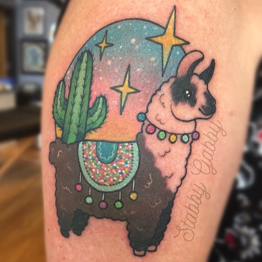 Vibrant llama tattoo with cosmic elements