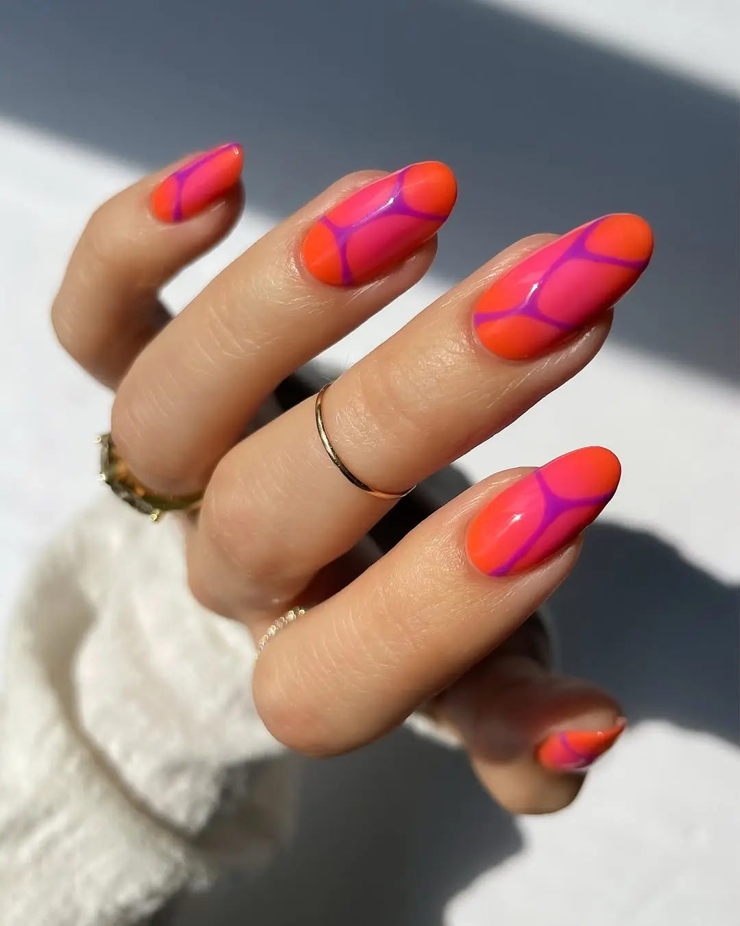 Vibrant summer nail art with geometric design
