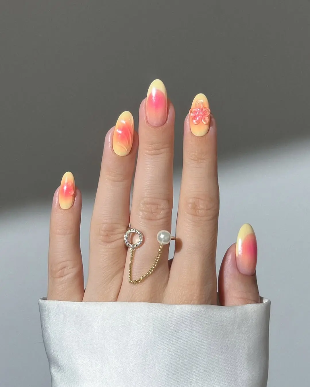 Vibrant gradient nails with floral accents
