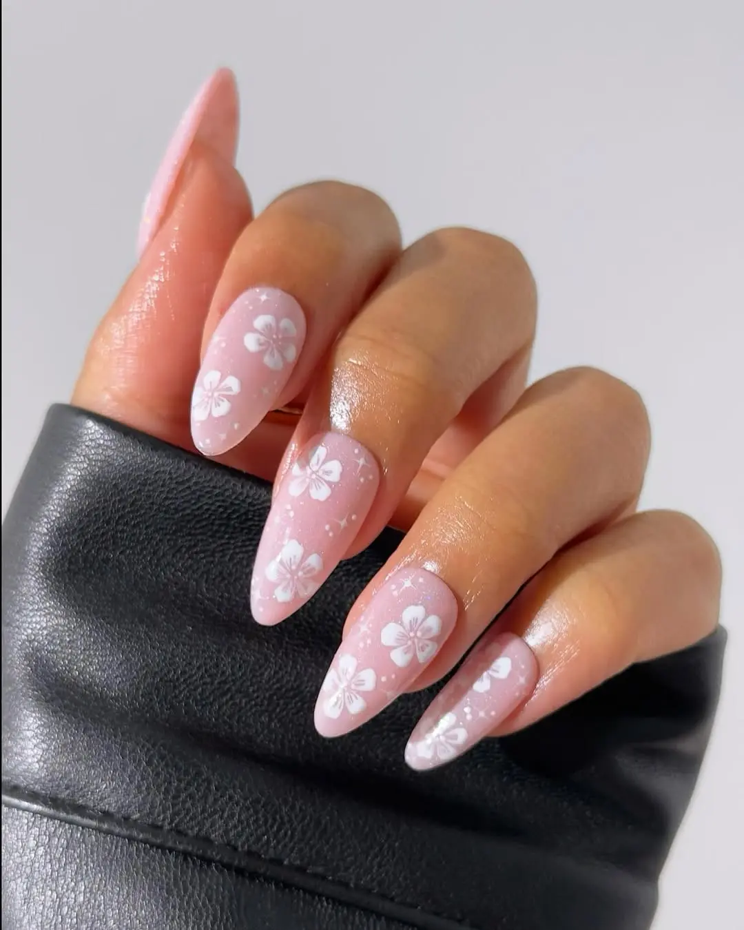 Chic floral designs on sparkling nails