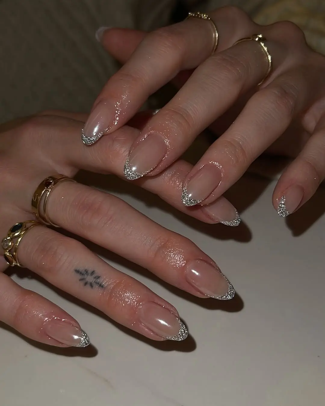 Elegant sparkly ombre nails with glitter tips