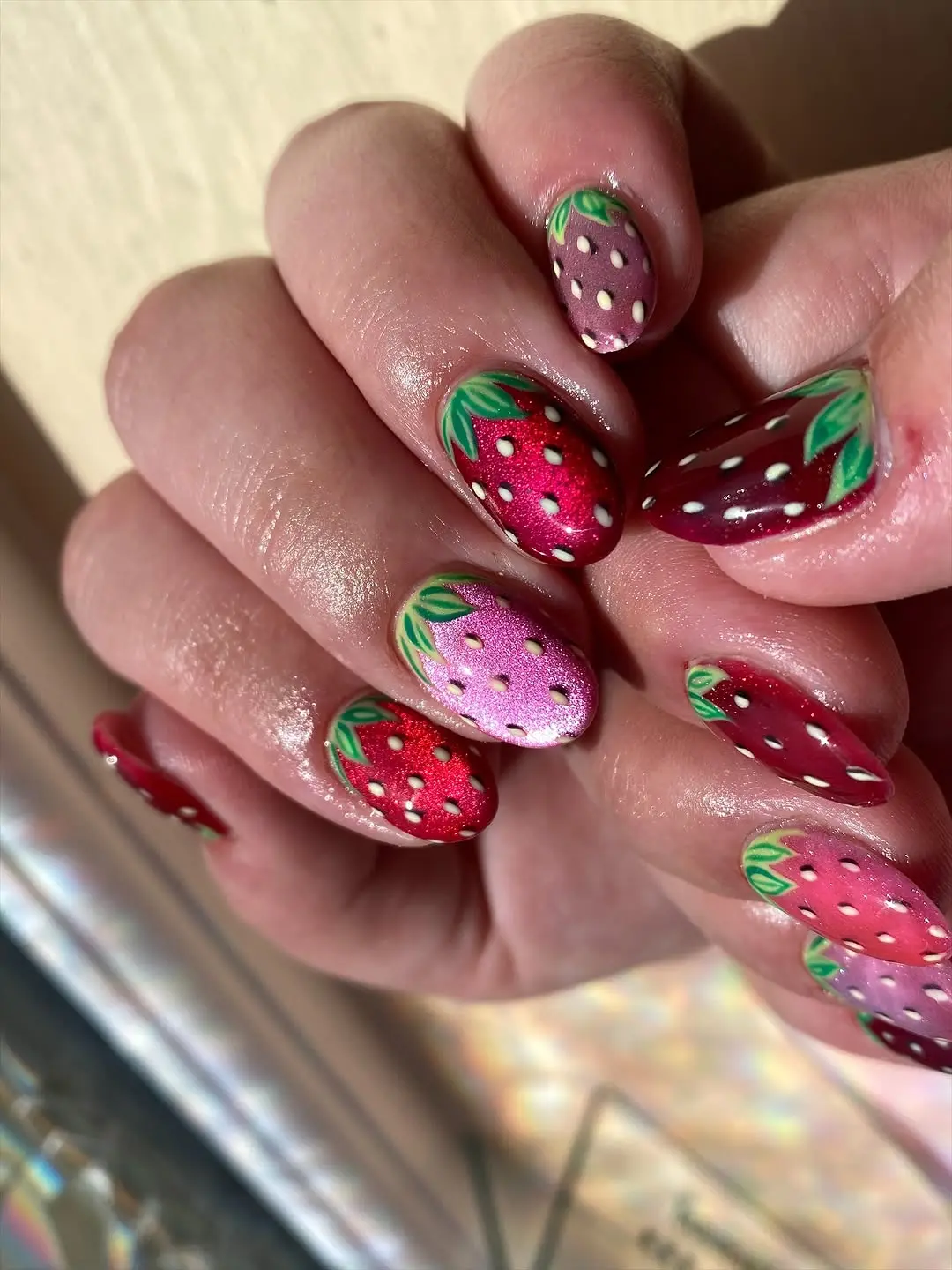 Vibrant Strawberry Designs on Sparkly Nails