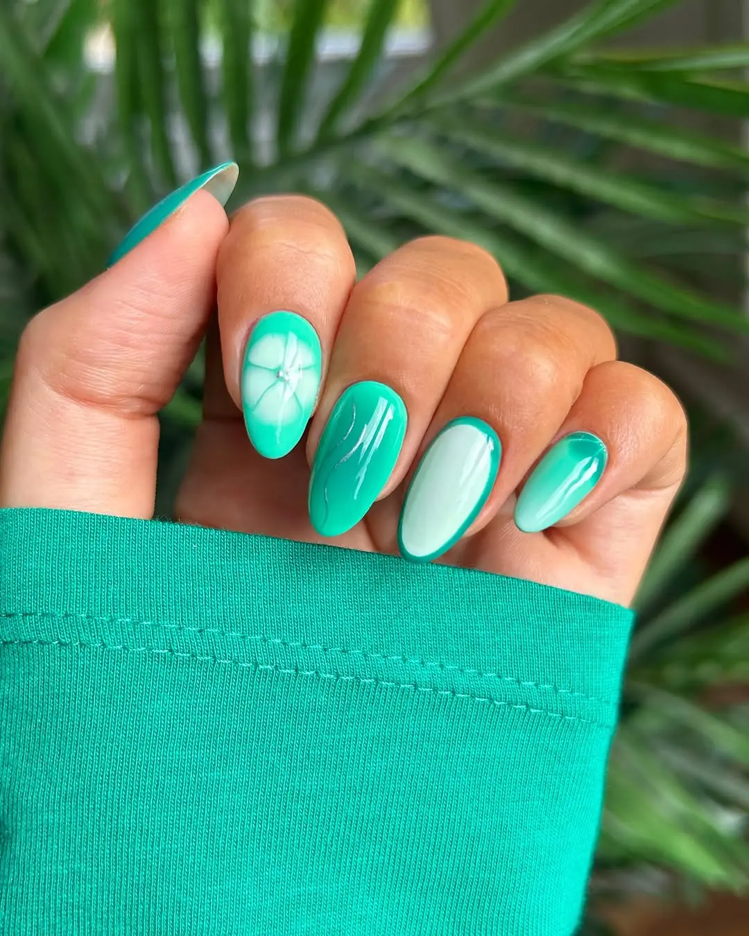 Vibrant Aqua Nails with Floral Accents