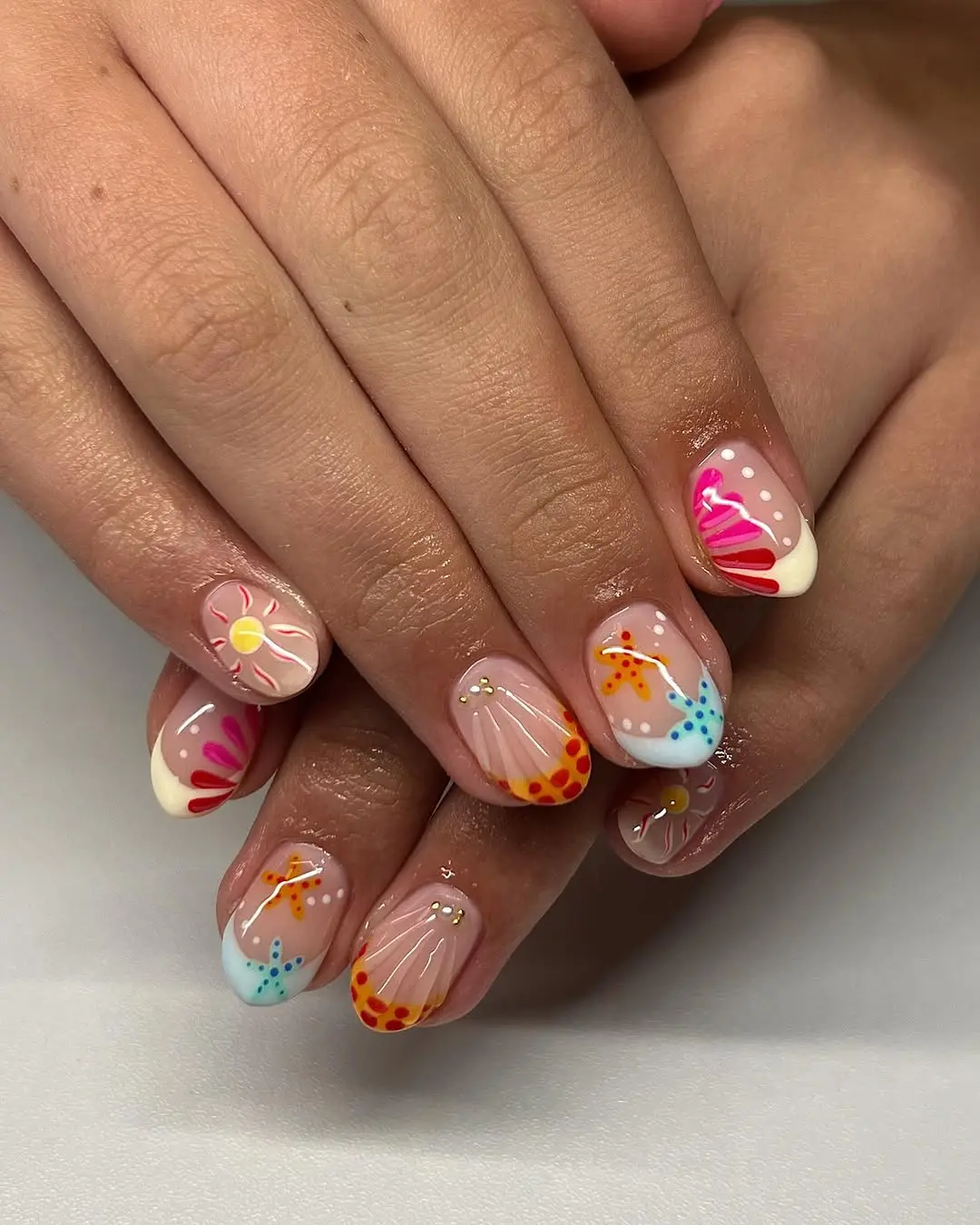Vibrant summer nails with ocean-inspired designs
