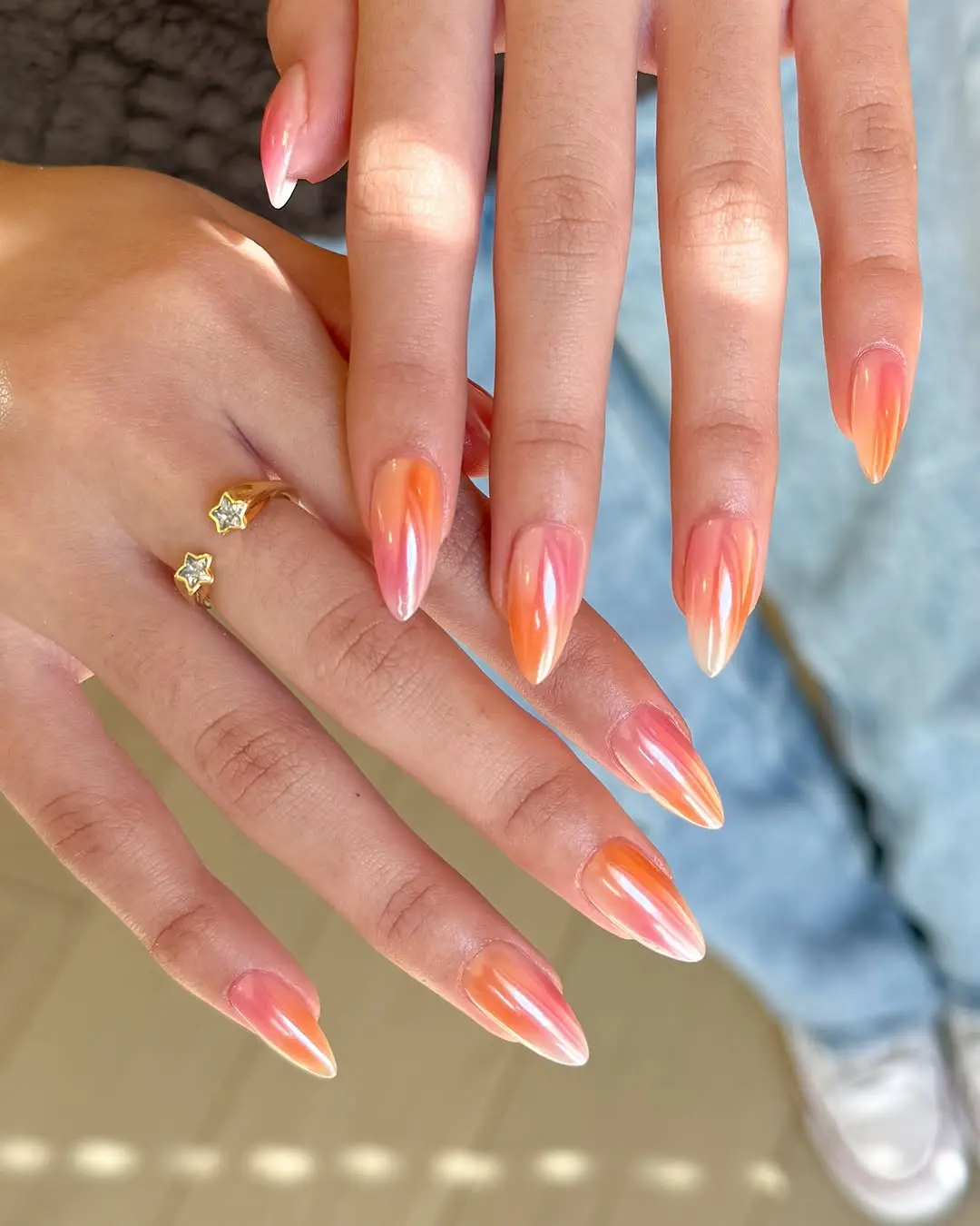 Vibrant stiletto nails in sunset hues