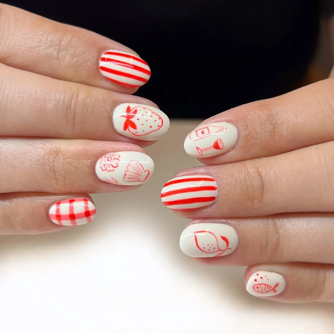 Playful summer nails with vibrant red accents