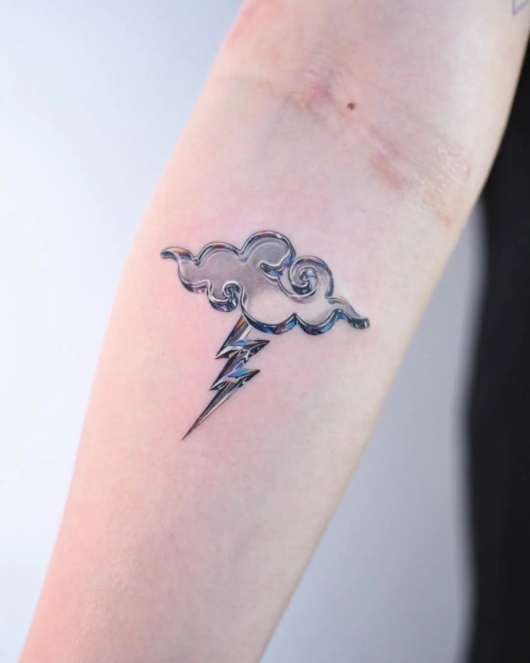 Stylish cloud with a lightning bolt tattoo