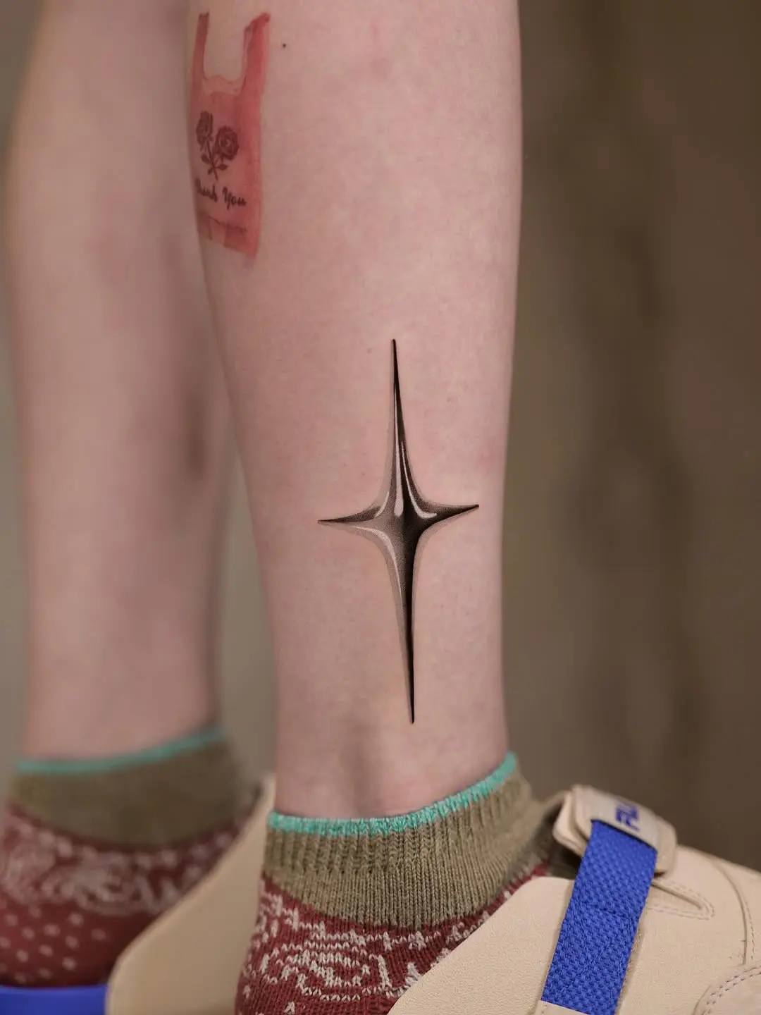 Stunning 3D star tattoo on ankle.
