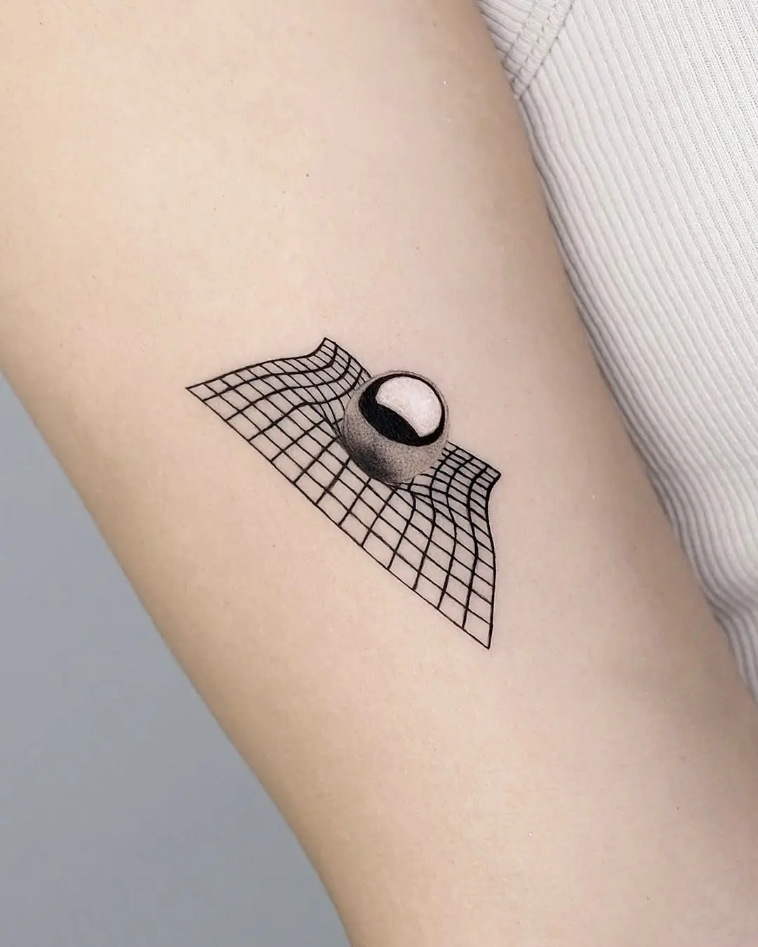 Intriguing 3D illusion tattoo on arm