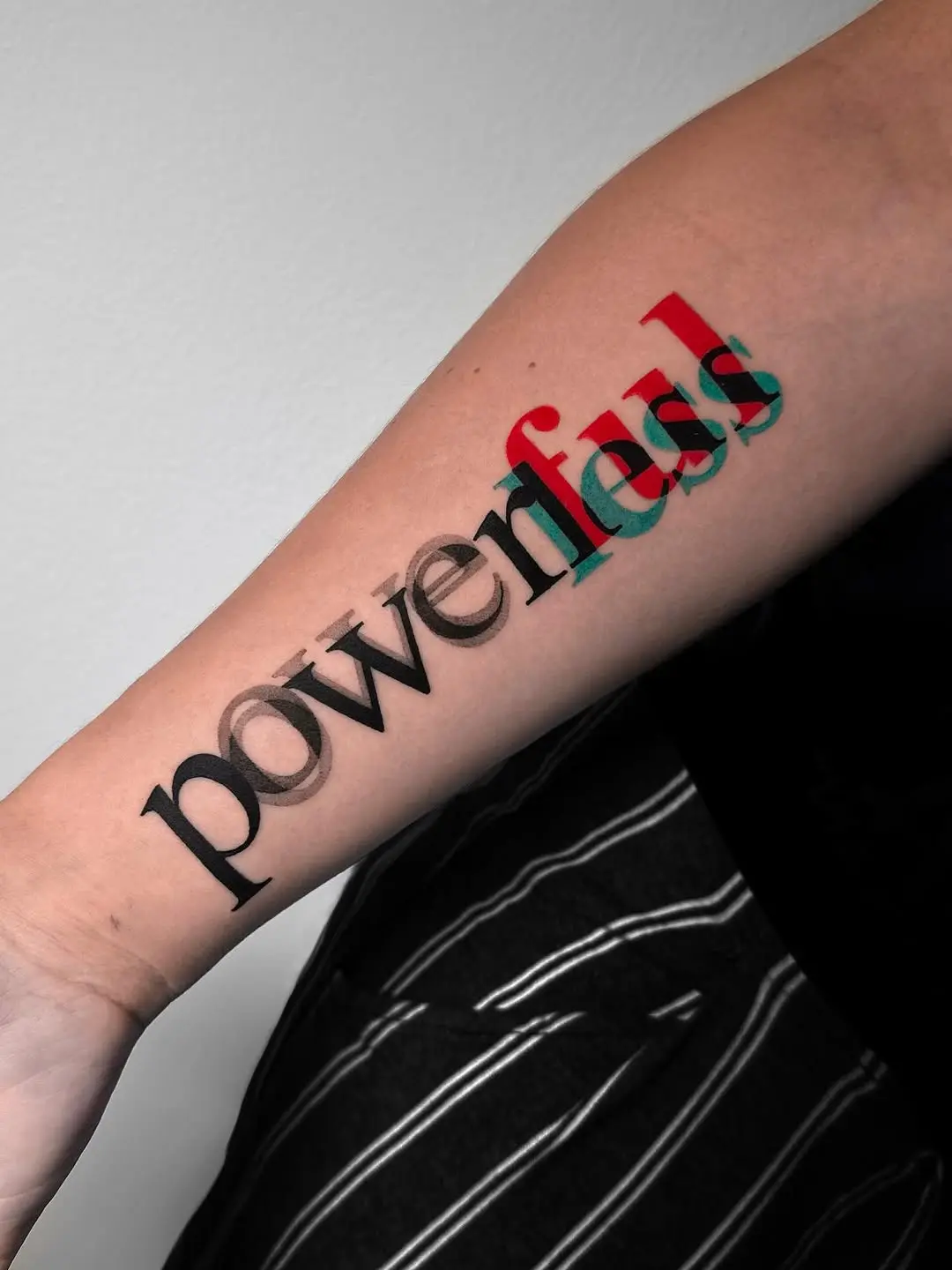 Striking 3D text tattoo design