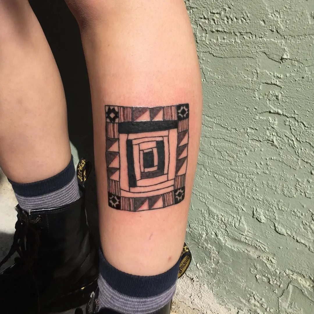 Intriguing geometric quilt-inspired tattoo design