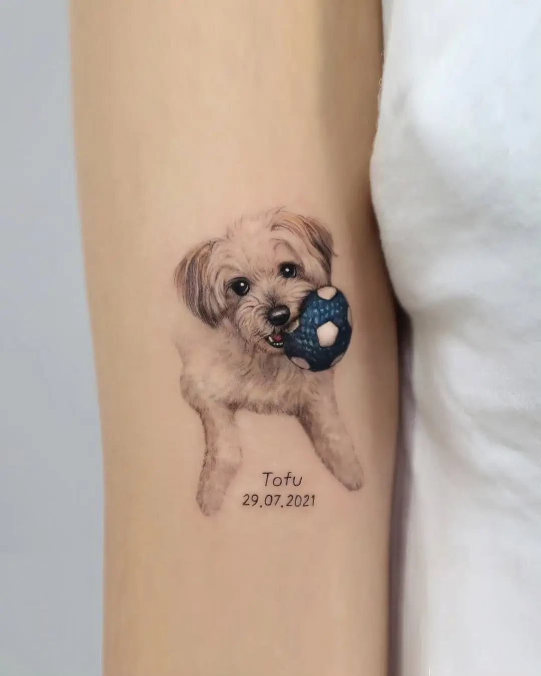 Charming poodle tattoo capturing joyful playfulness
