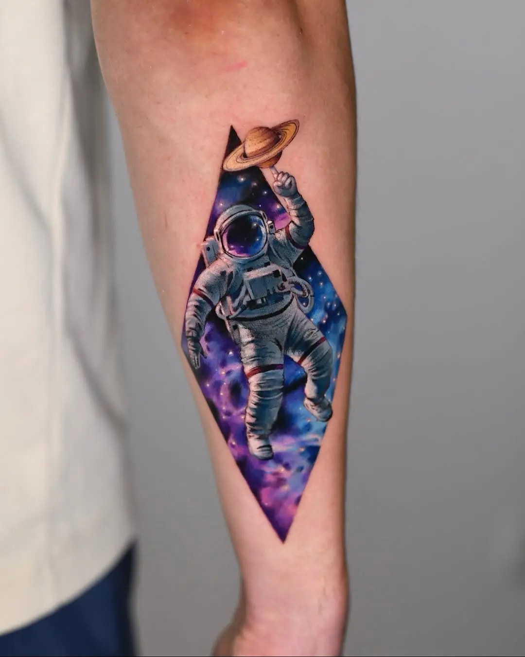 Cosmic Astronaut Surrounded by Vibrant Galaxies