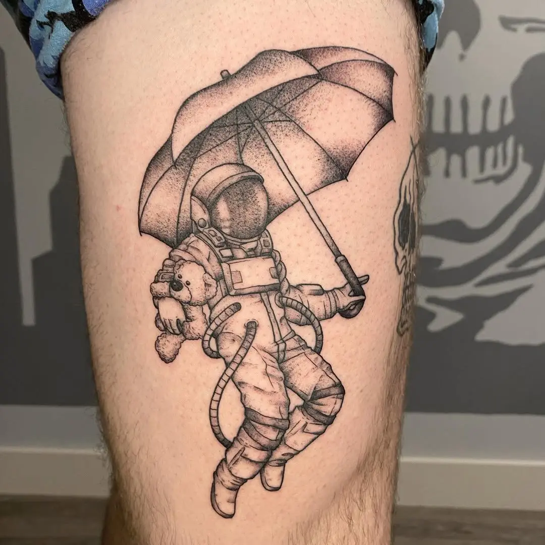 Whimsical astronaut sheltered by an umbrella
