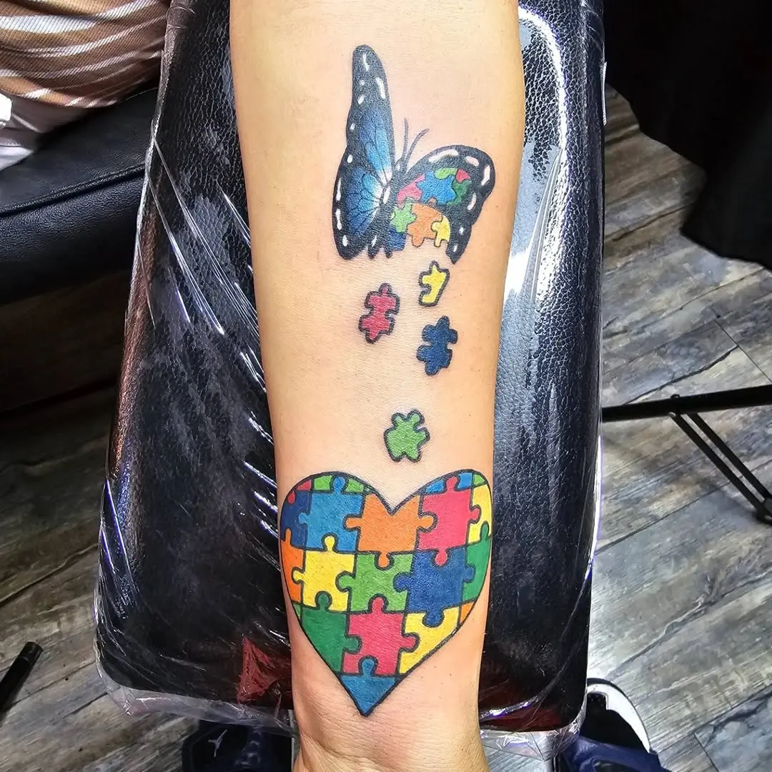 Vibrant Butterfly and Puzzle Heart Tattoo