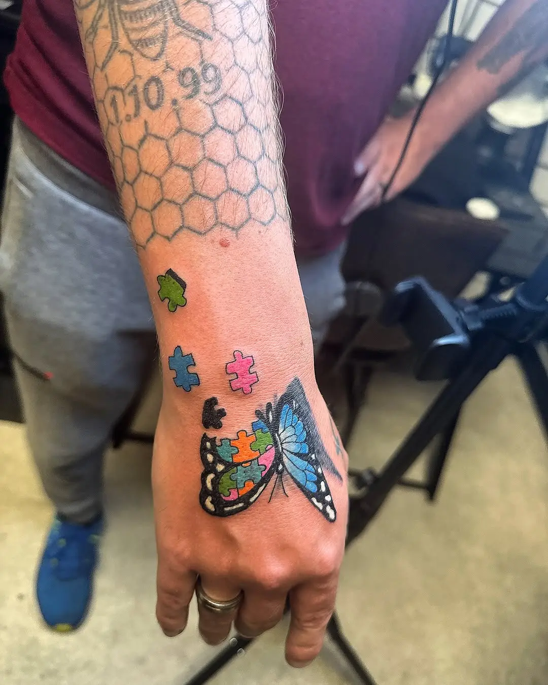 Colorful butterfly and puzzle piece tattoo design