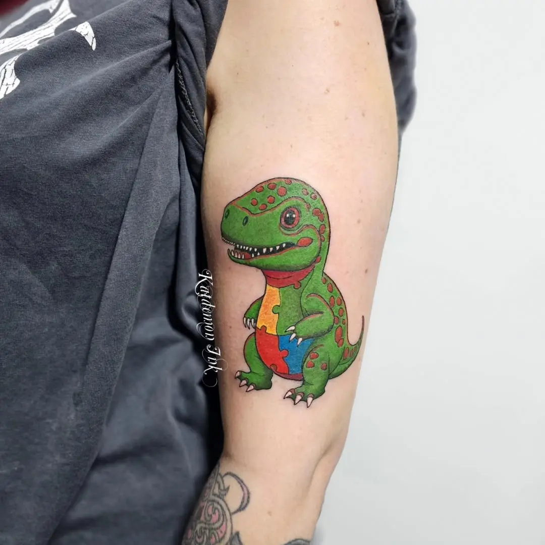 Vibrant lizard tattoo celebrating autism awareness