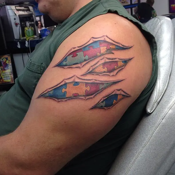Colorful puzzle piece tattoo showcasing autism awareness