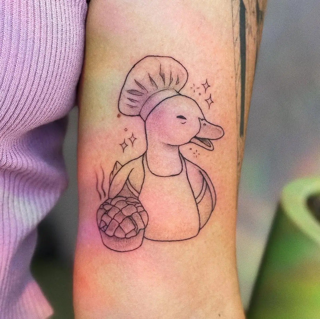 Charming duck tattoo represents baking joy
