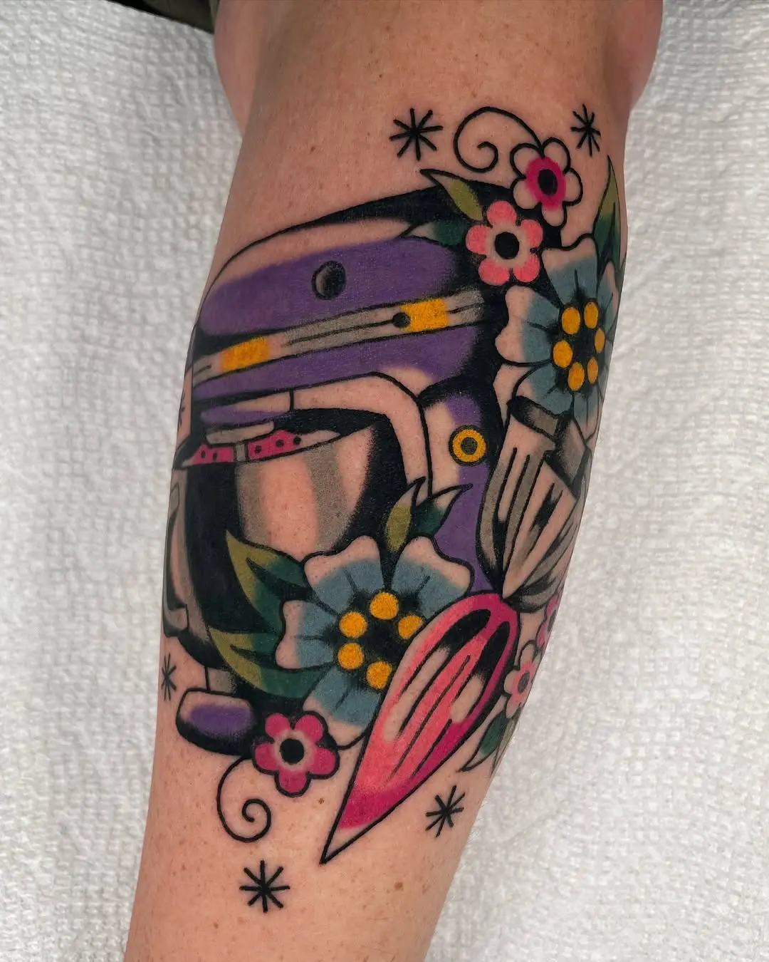 Vibrant Mixer Tattoo with Floral Accents