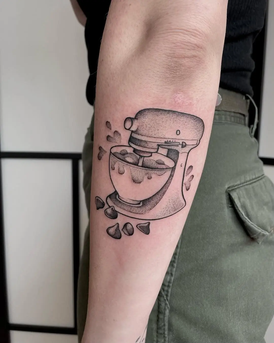 Whimsical mixing tattoo with chocolate charm