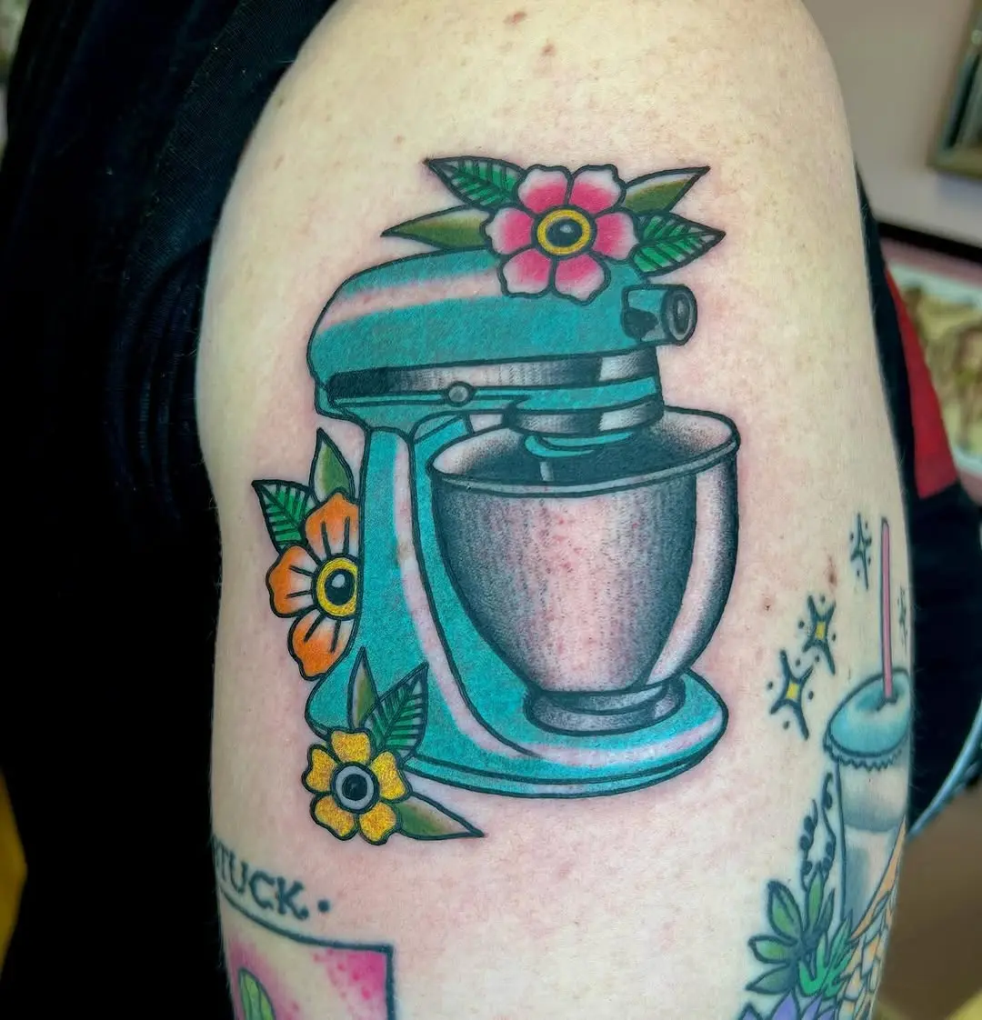 Colorful tattoo of a vintage kitchen mixer
