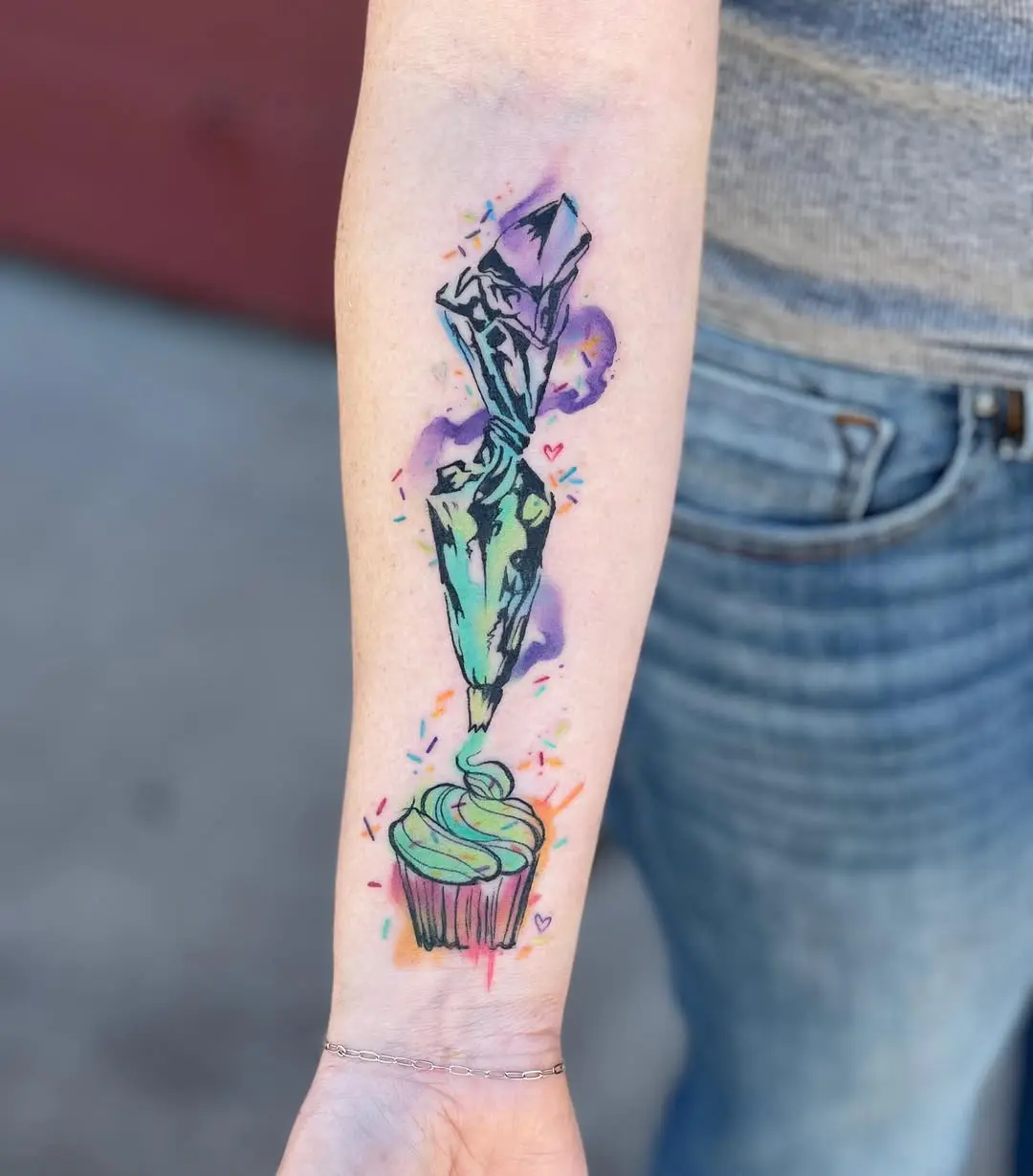 Whimsical cupcake tattoo with piping bag design
