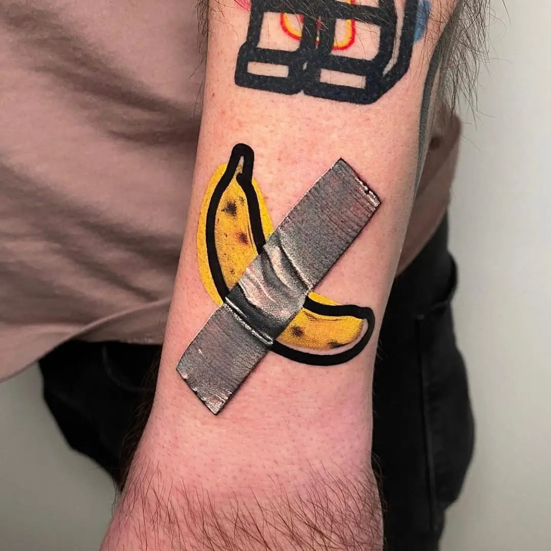 Quirky banana tattoo with a bandage design