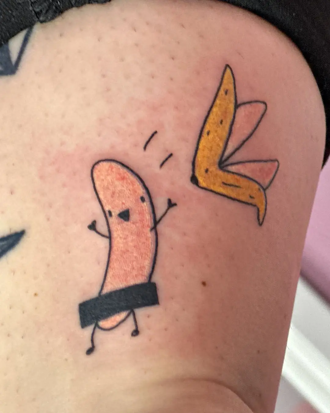 Playful banana tattoo with cartoon character vibe