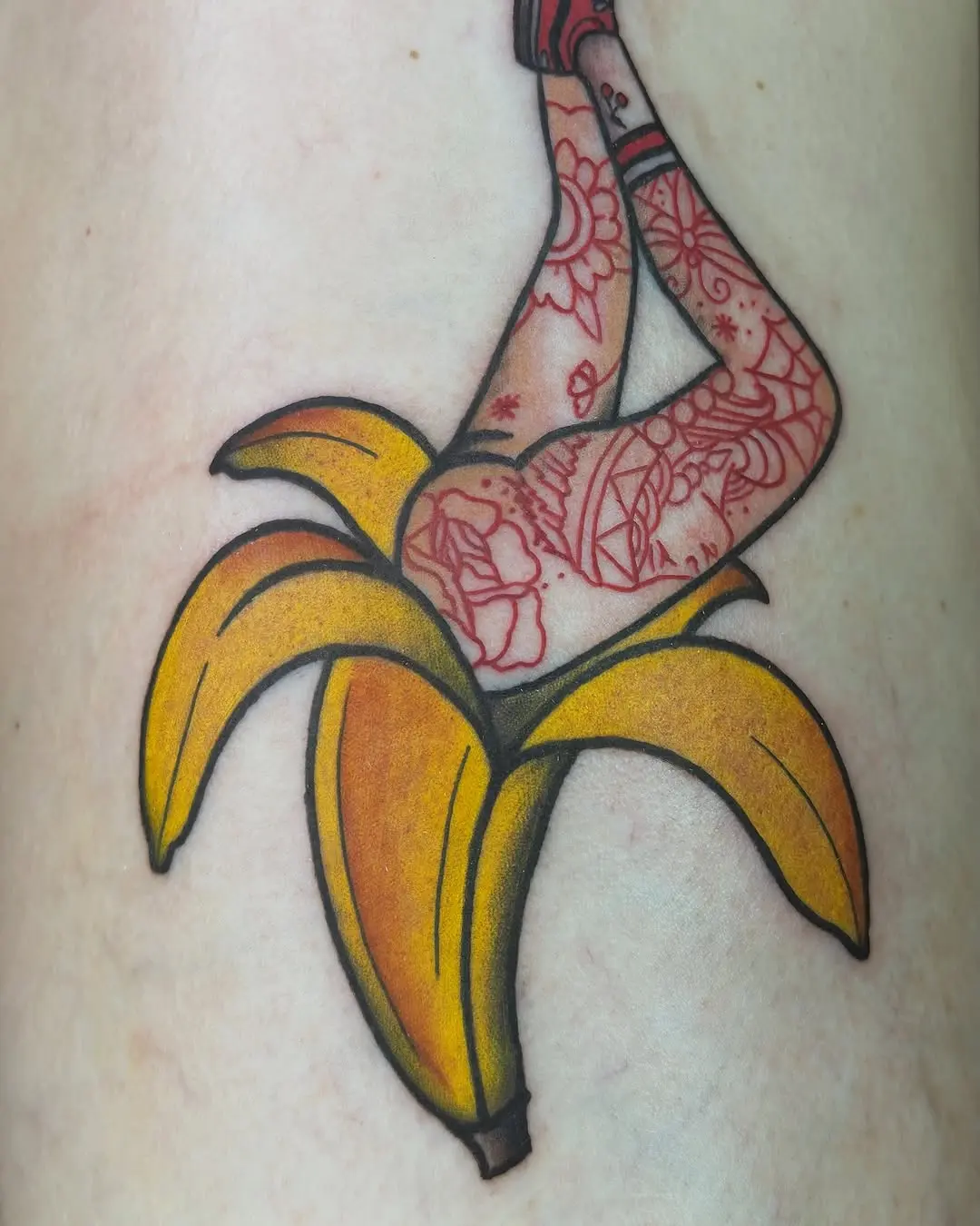 Whimsical banana tattoo with creative details