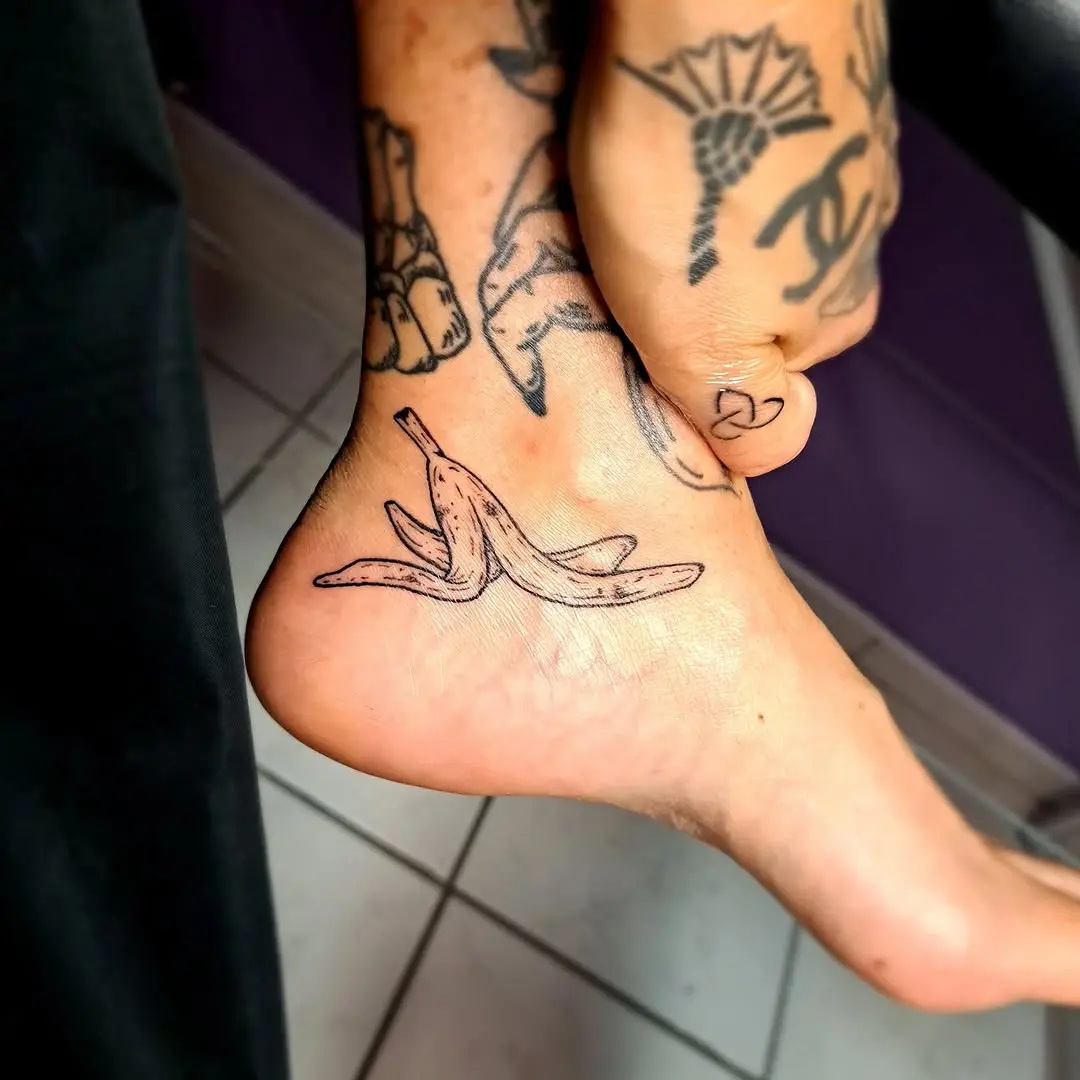 Whimsical banana tattoo on the ankle