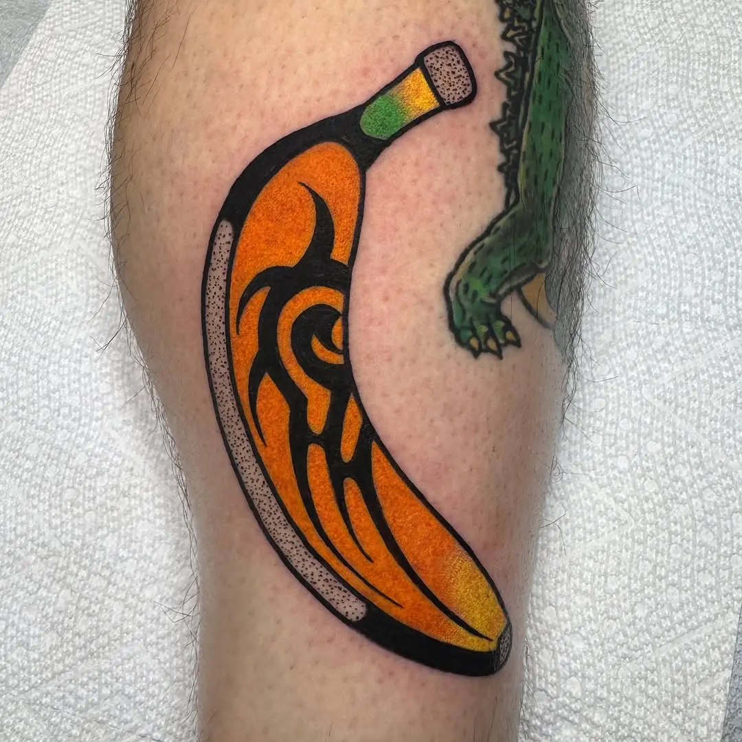 Vibrant tribal banana tattoo with bold colors