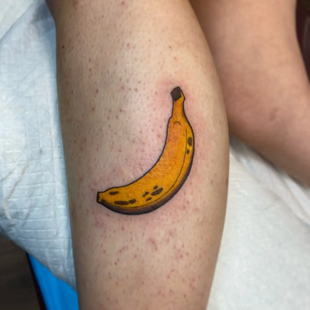Cute and colorful banana tattoo on leg