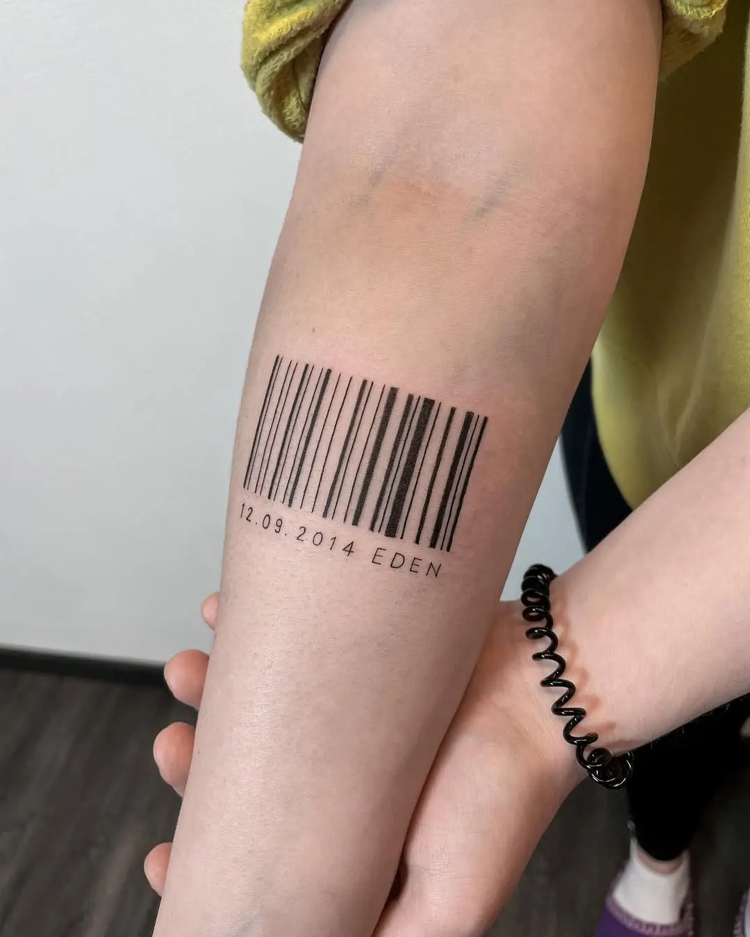 A unique barcode tattoo with personalized details