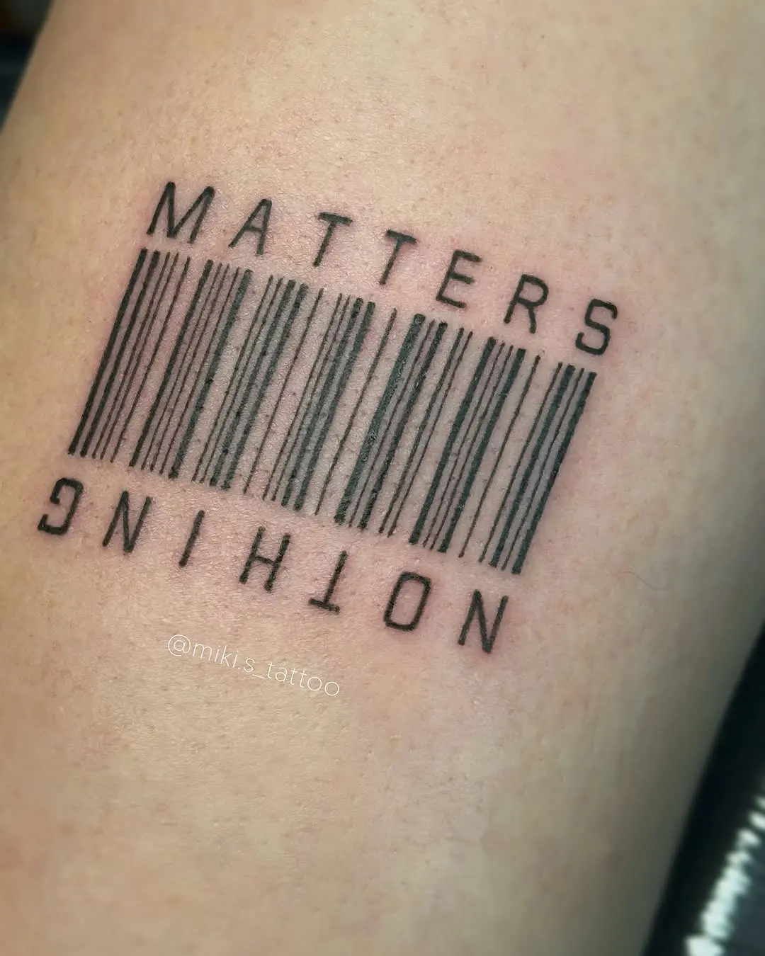 A striking barcode tattoo with a message