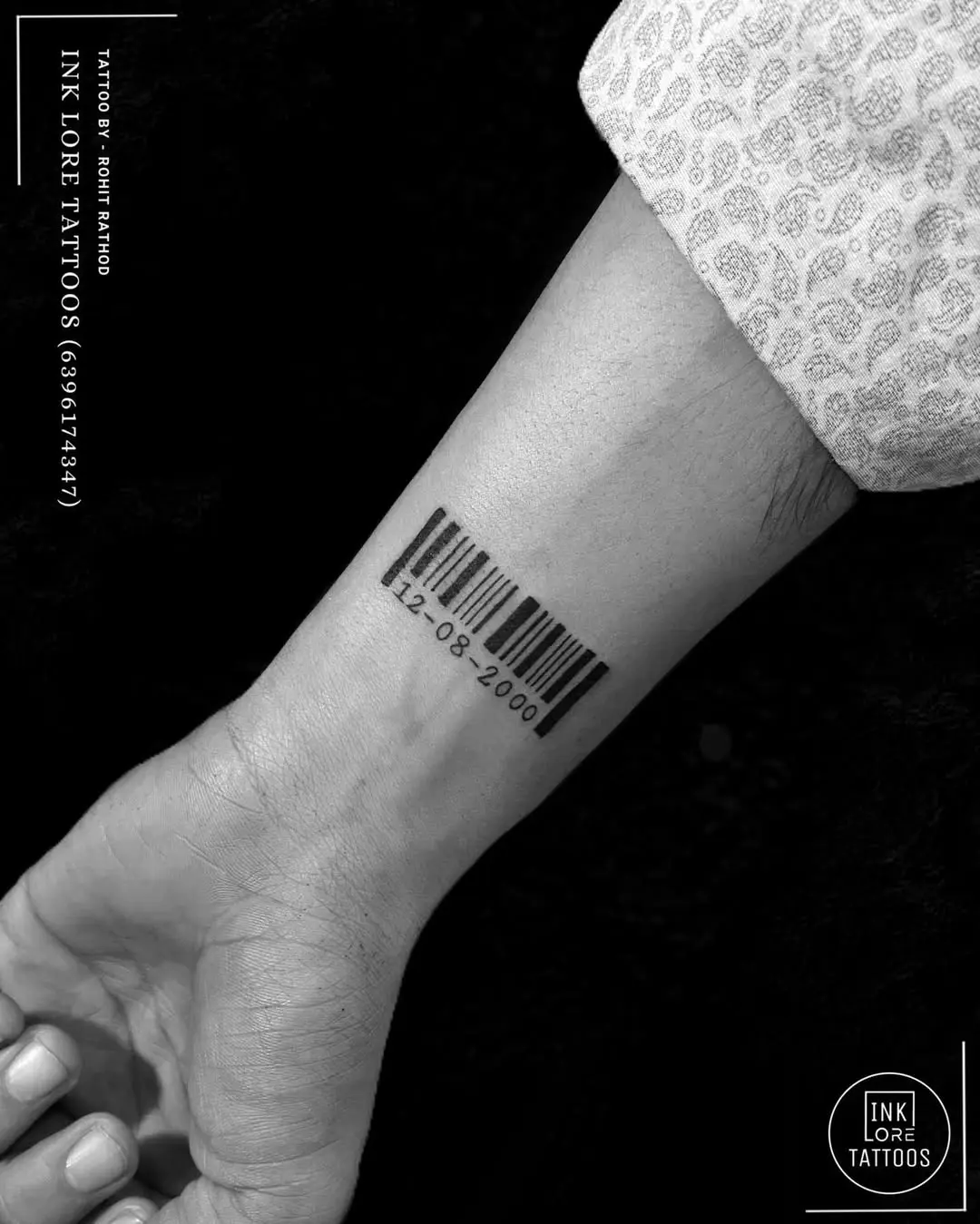 Stylish barcode tattoo on the forearm.